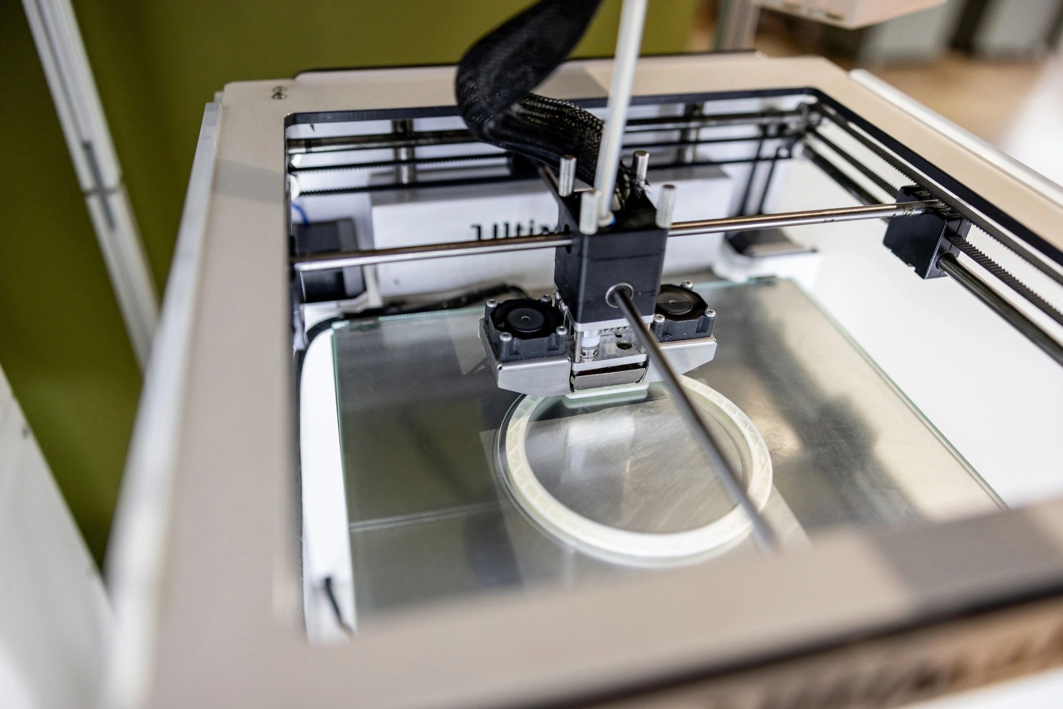 Close-up of a 3D printer producing a prototype part