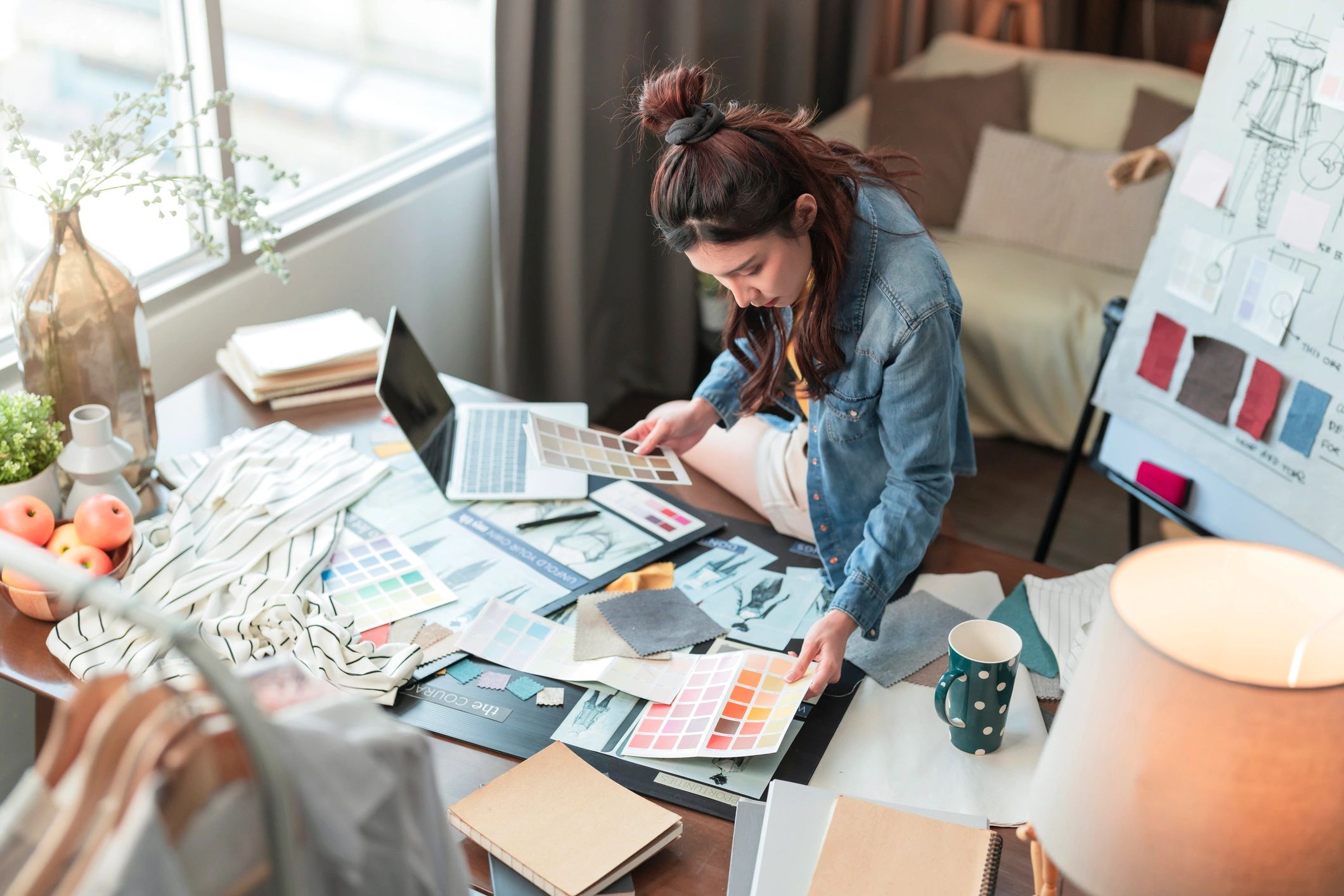Designer sketching product concepts at a desk