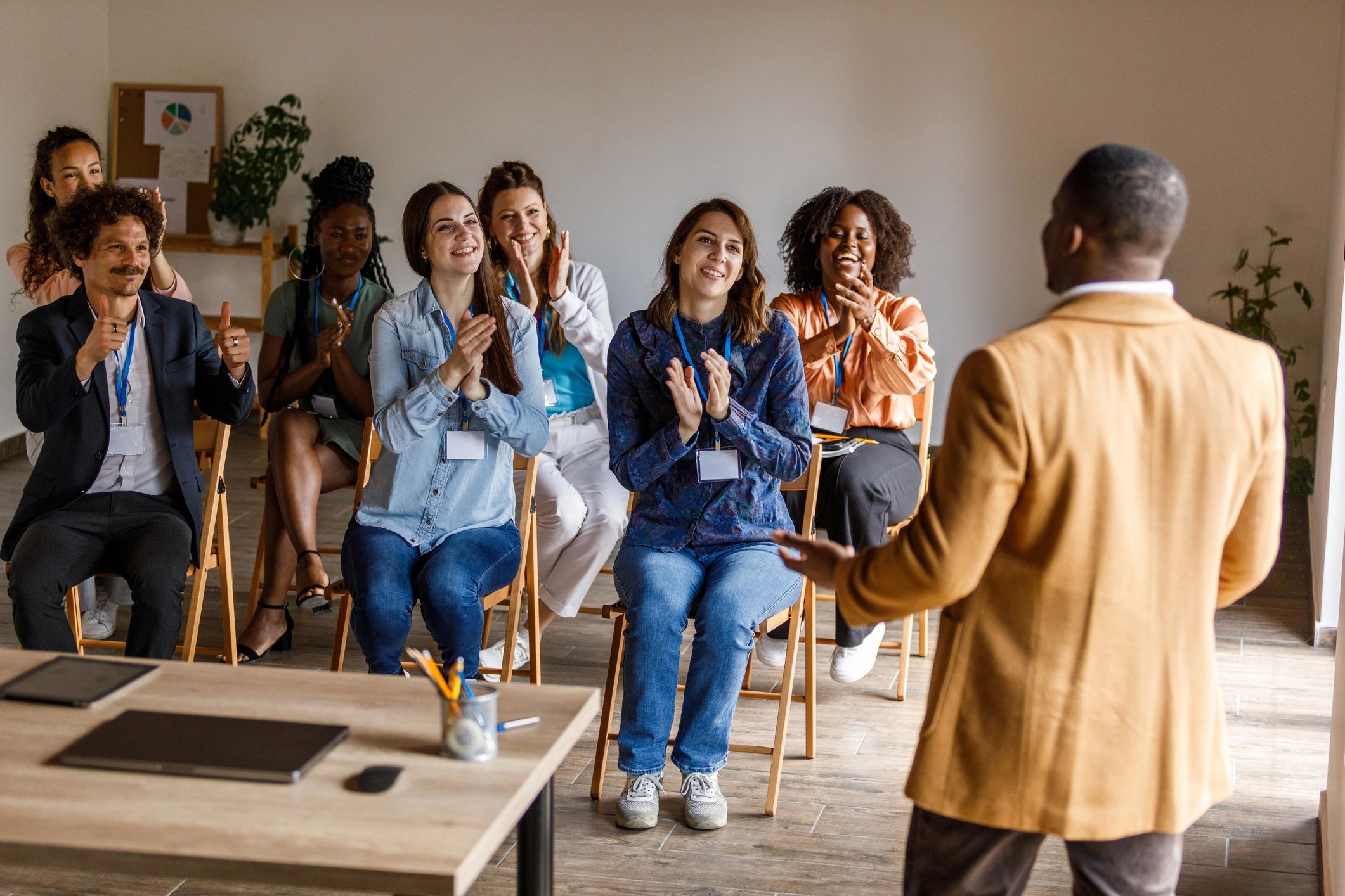 Presenter speaking to a group during a business seminar