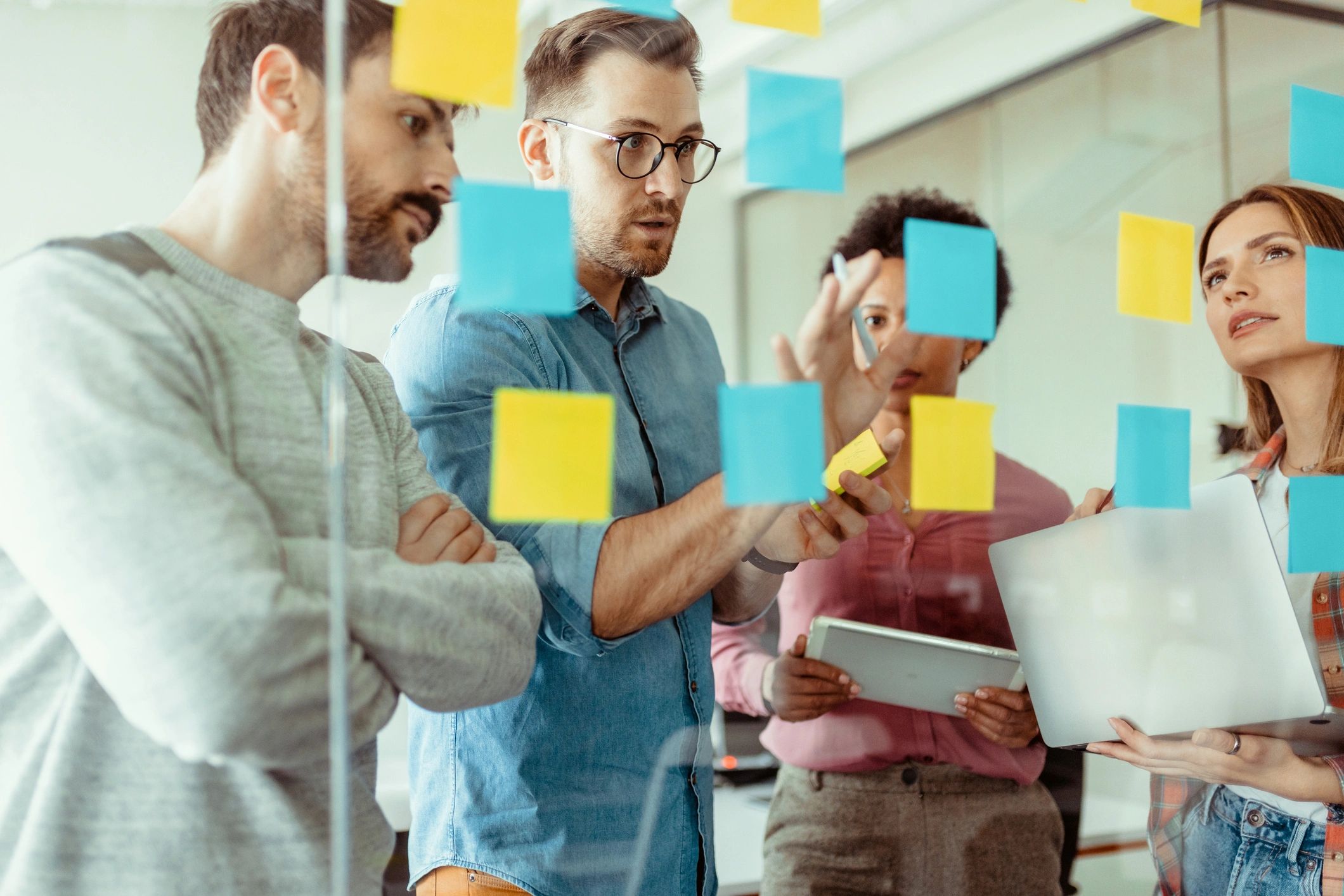 Team planning product strategy with sticky notes